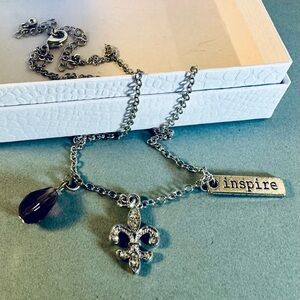 Silver Necklace with purple, fleur de lis, and “Inspire” Charms